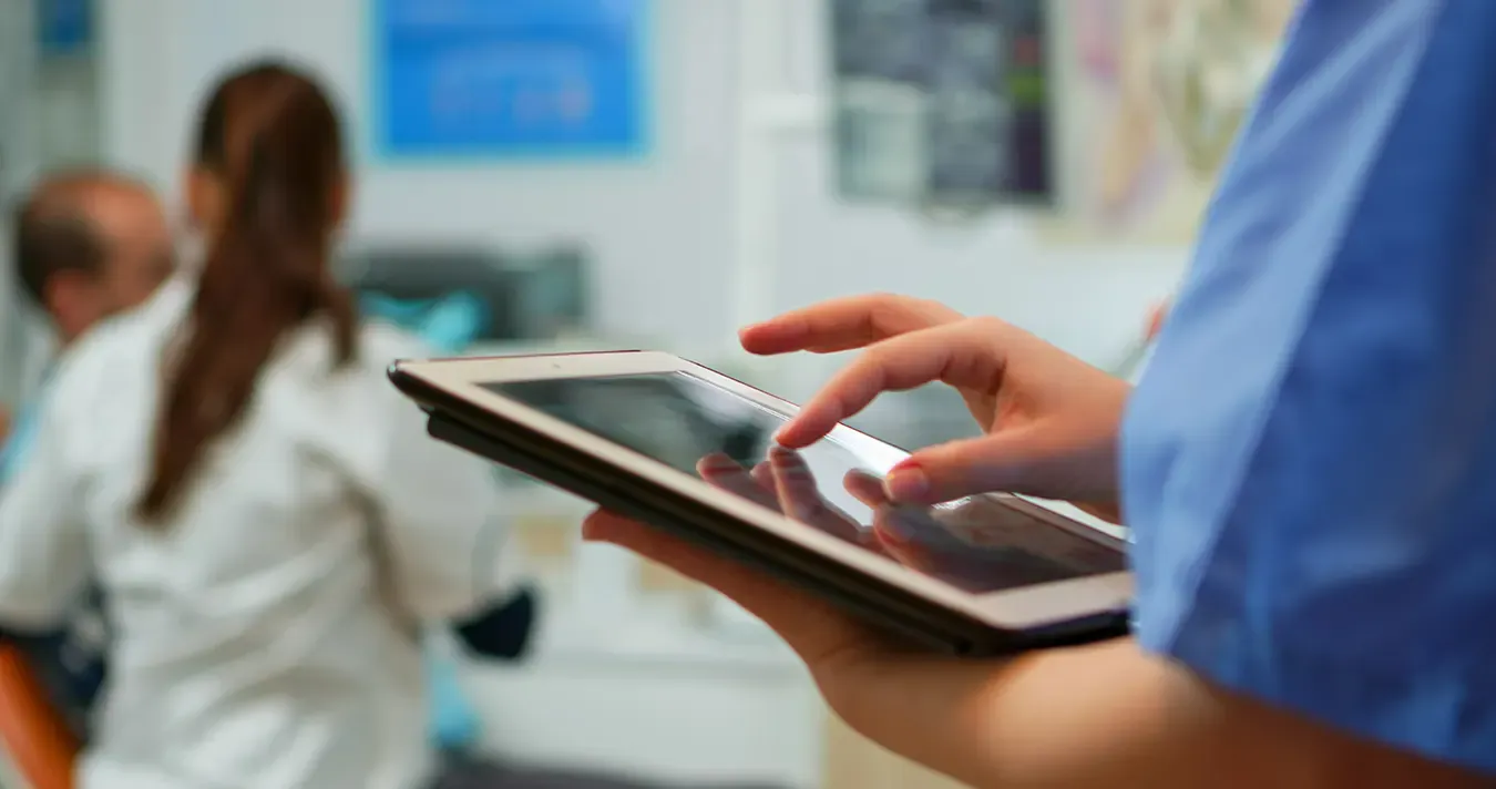 Image of nurse using tablet