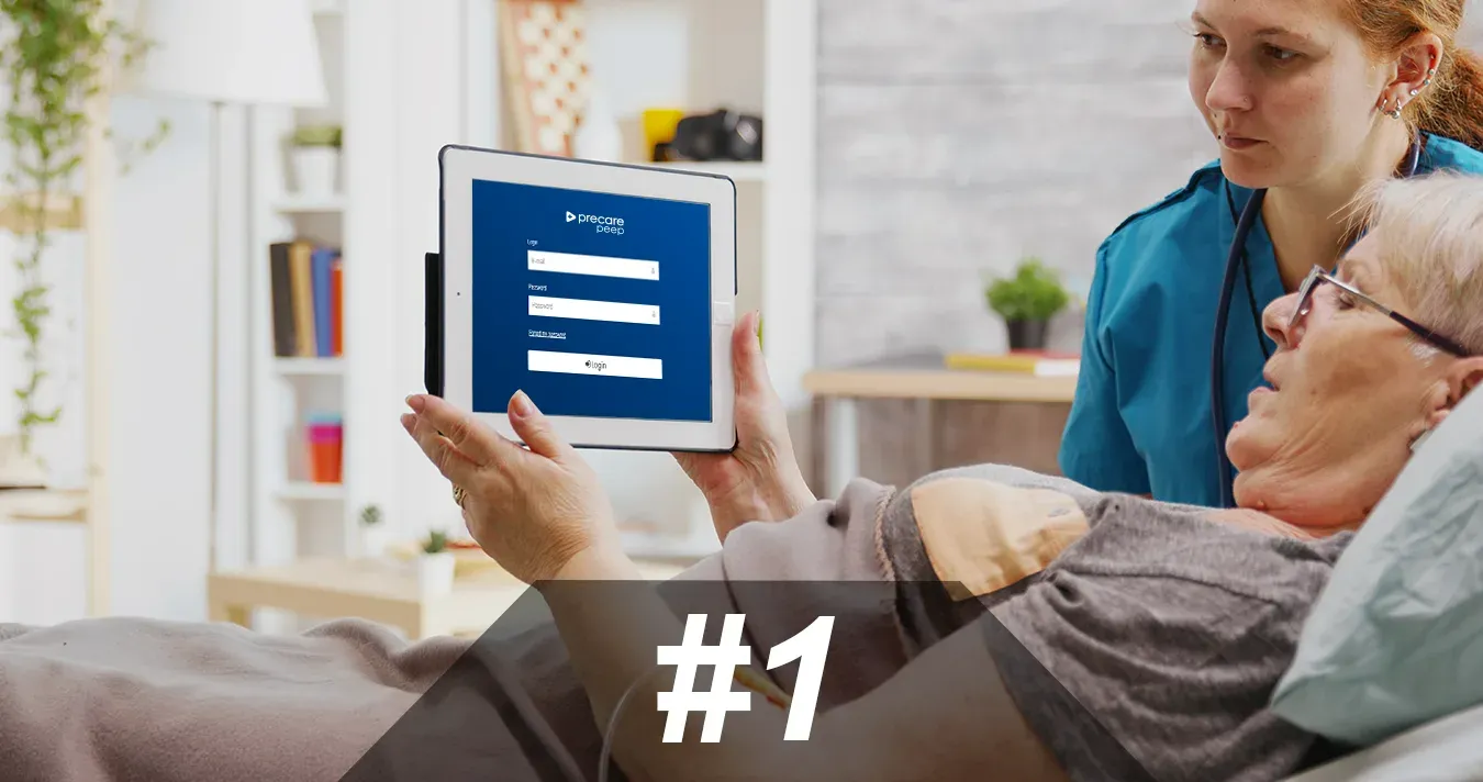 Image of elderly woman and her nurse accessing the Precare portal